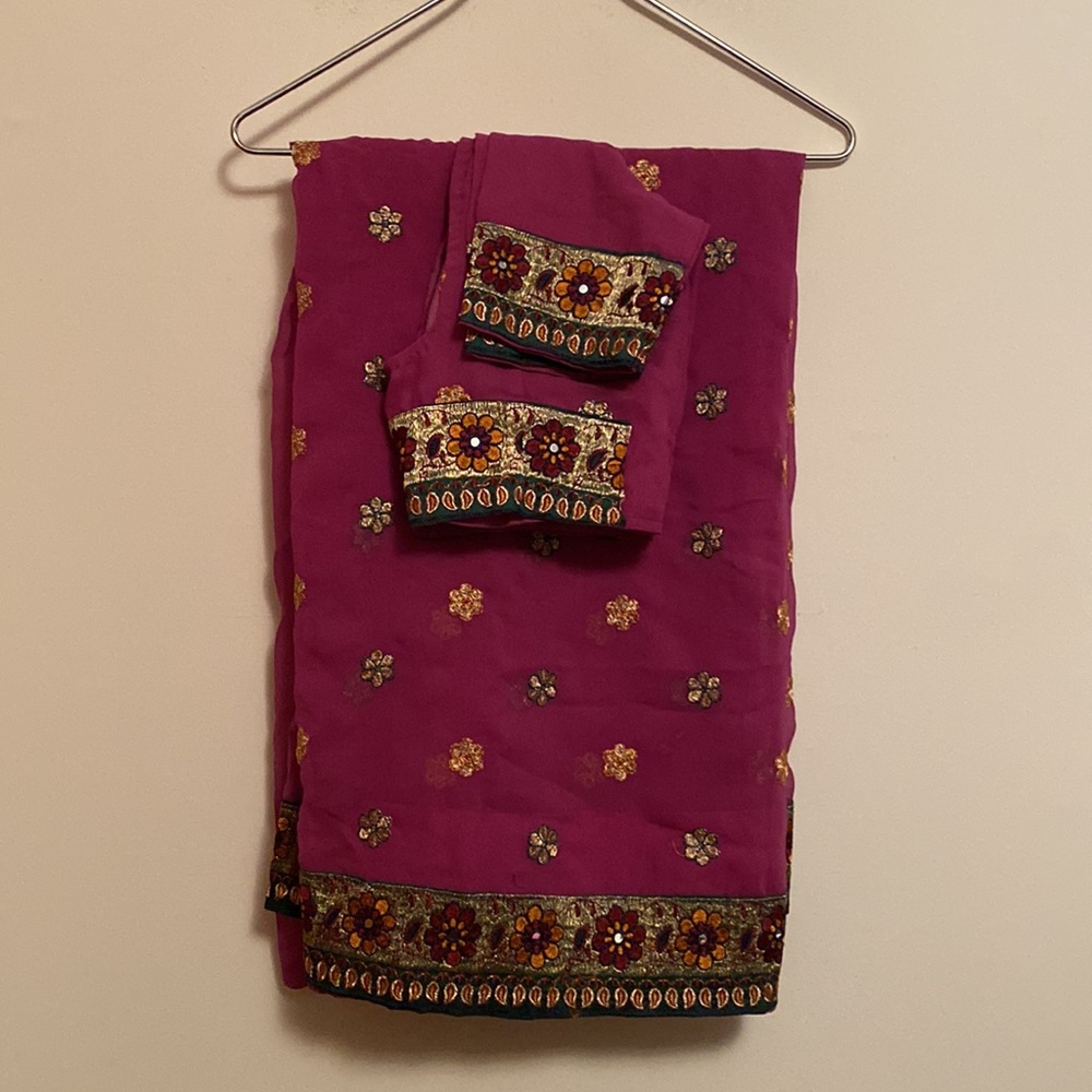 Magenta colored saree with matching stitched blouse